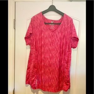 Bright pink activewear top with small reflectors
